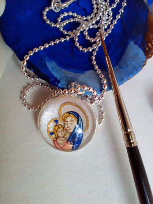 médaillon de baptême plaqué argent avec enluminure de la vierge à l'enfant